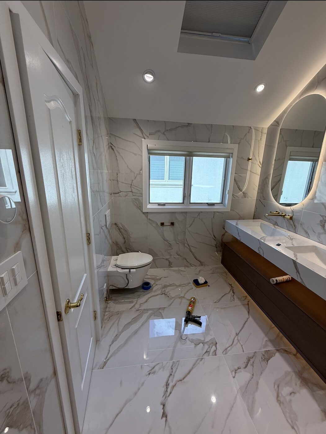 Finished bathroom suite with skylight and floating vanity — Staten Island bathroom remodel